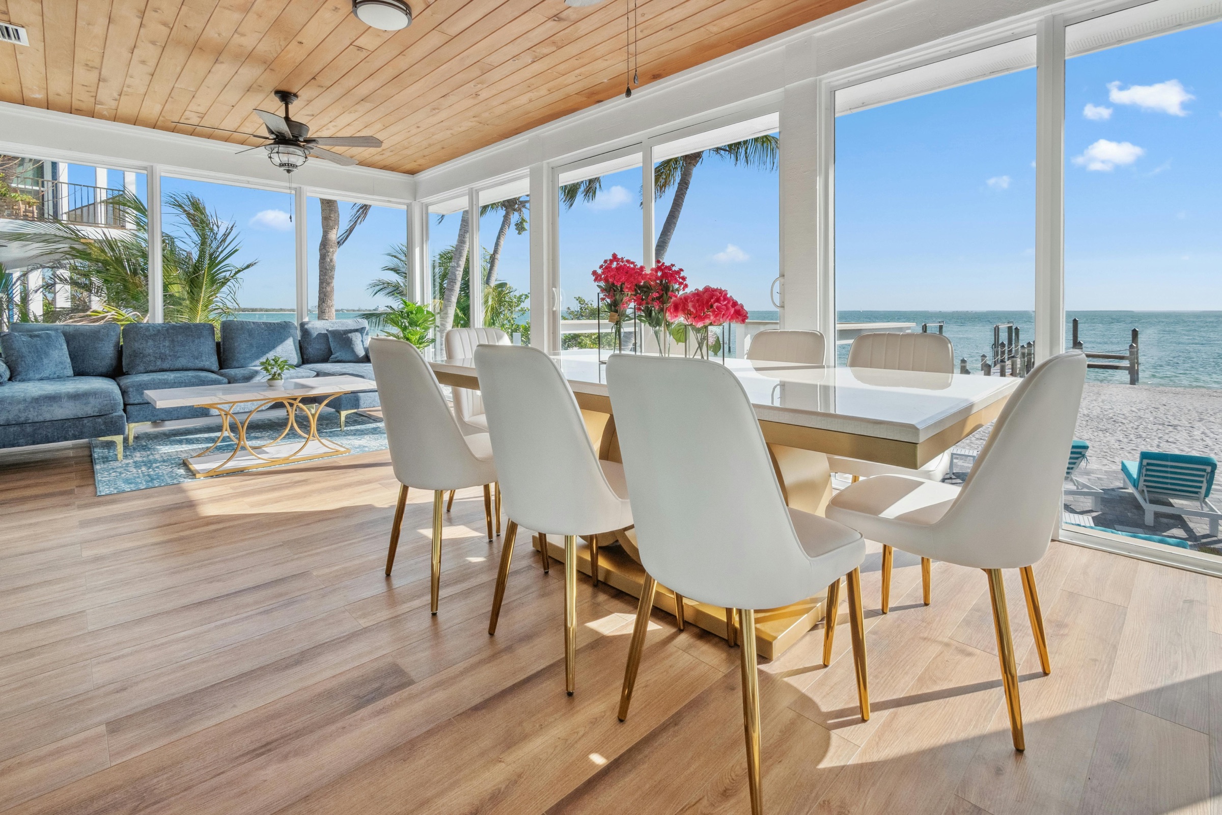 Quiet oceanfront living space with floor-to-ceiling windows and a private waterfront view